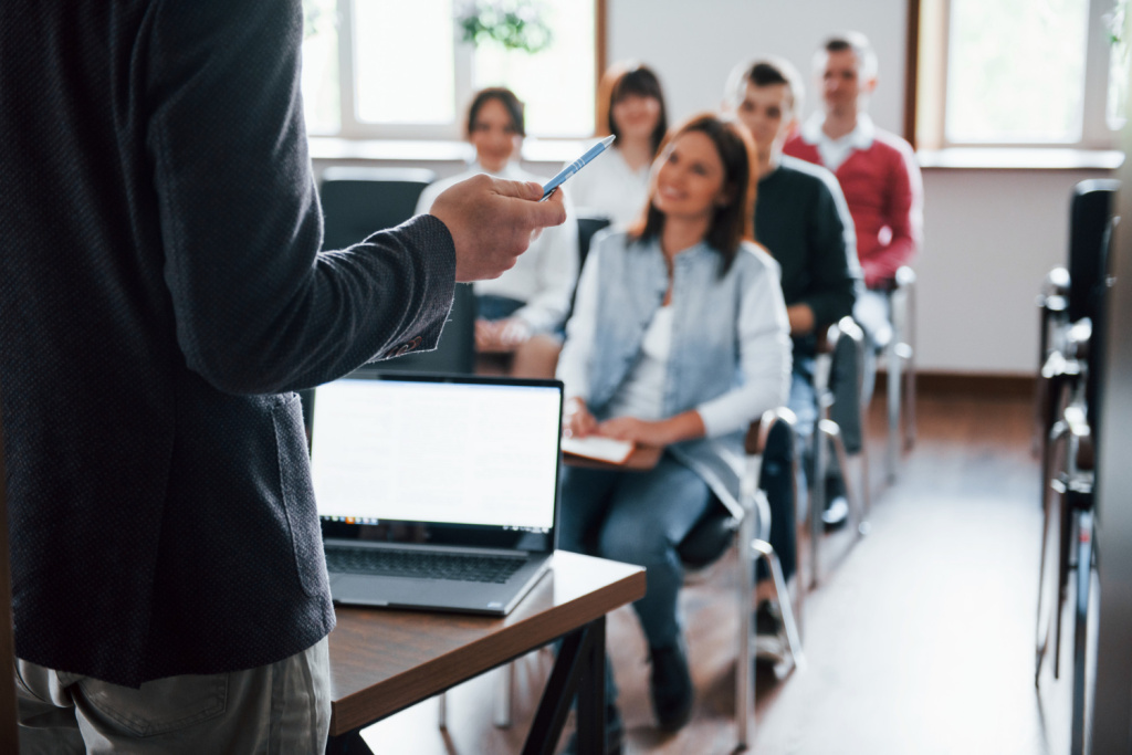 everyone-is-smiling-listens-group-people-business-conference-modern-classroom-daytime.jpg